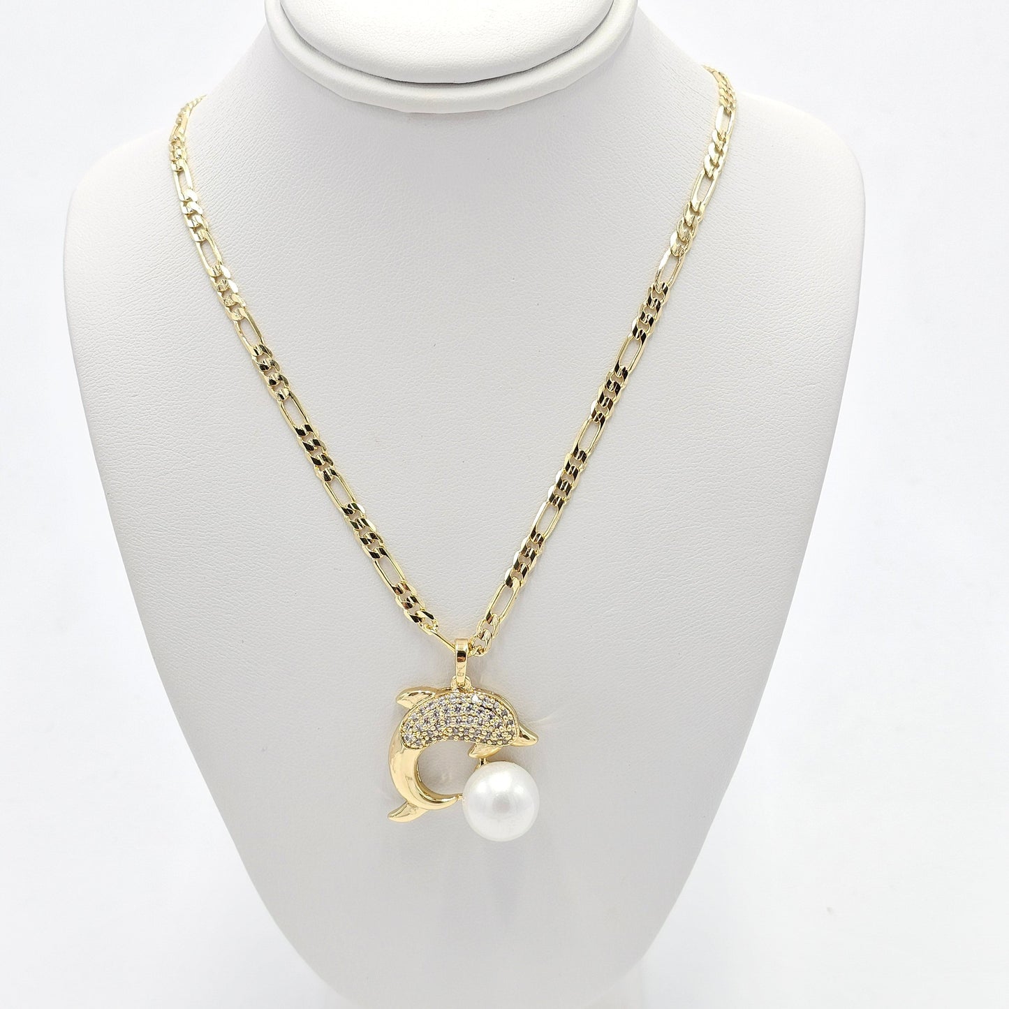 pearl dolphin pendant and figaro chain. size 23 inches
