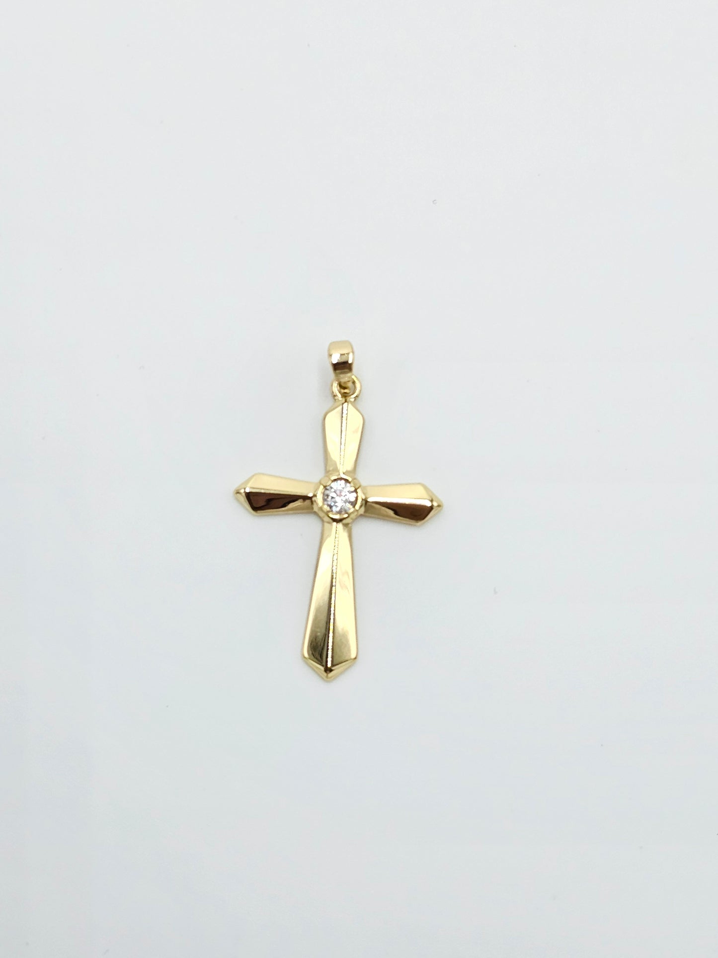 Golden zircon cross.  4 cm (chain not include)